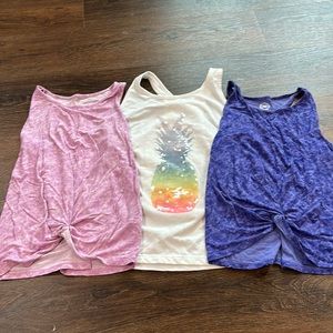 Lot of 3 tops. 2 out of 3 tops are a Medium. 1 out of the 3 tops is a Large.
